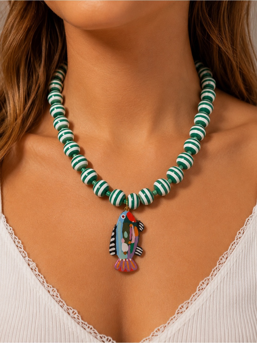 Green and White Striped Bead Necklace with Colorful Fish Pendant